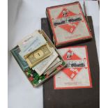 An old Monopoly game with metal playing pieces and wooden hotels and houses