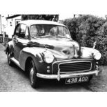 A 1959 Morris Minor 1000 saloon car in restored condition and grey livery with burgundy red