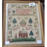 A small needlework sampler with a rural scene of a house amidst trees with a girl and dogs with