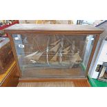 A scratch built model of a fully rigged three masted sailing ship in glazed oak case