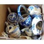 A box containing blue and white ceramics including Willow pattern, Delftware, etc.