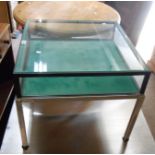 A 61cm modern brushed steel framed table vitrine with glazed top and sides, set on square legs