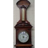 A late Victorian ornate walnut framed wall barometer/thermometer with printed ceramic dial and