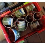 A box containing a quantity of Abbot pottery comprising jugs, mugs and bowls