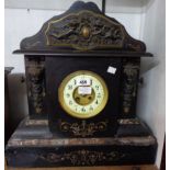 A late Victorian large ornate black slate and marble cased mantel clock with cast metal frieze and