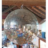 A large ceiling hanging mirror ball