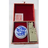 A Chinese ink stamp set comprising carved hardstone seal and porcelain dish containing ink block, in