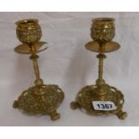 A pair of Victorian cast brass candlesticks with Rococo scroll decoration - marked for William Tonks