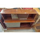 A 1.1m vintage mahogany two section modular bookcase enclosed by two pairs of glass sliding