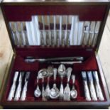 A vintage oak canteen containing a Winegartens six place setting of kings pattern cutlery - from an