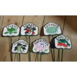 A set of six modern painted cast iron vegetable labels