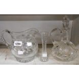 A cut glass claret jug and stopper (handle a/f), a cut crystal jug of helmet form and a Webb Corbett