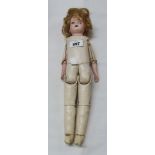 An old German porcelain headed doll with sewn leather body and glass eyes - a/f to eye sockets