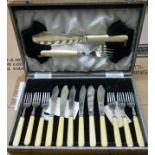 A vintage cased set of six each silver plated fish knives and forks with servers and Ivorine