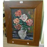 An oak framed oil on canvas still life with roses in a vase - indistinctly signed