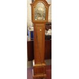 An early 20th Century oak cased grandmother clock, the 21.5cm silvered arched dial bearing