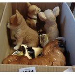 A box containing a quantity of china and resin figures including Pekingese, Chihuahua, etc. - sold