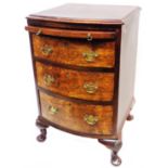 A 45.5cm antique stained walnut and mahogany bow front bachelor's chest with brushing slide and