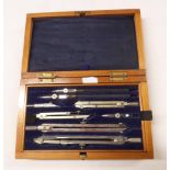 An early 20th Century drawing set in original fitted lift-top box