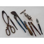 A bag containing a quantity of collectable items, including tools, corkscrew, etc.