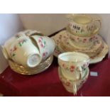 A Duchess china part tea set comprising milk and sugar, six trios and bread and butter plate