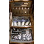 A vintage oak canteen containing a six place setting of Cavendish silver plated cutlery with steel