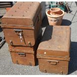 Three vintage tin travelling trunks