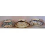 A late 19th Century Coalport bone china trio of lobed form with jewelled style decoration - sold