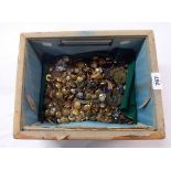 A basket containing a large collection of antique and later military buttons including Devon, West