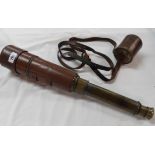 An old five draw leather clad brass telescope