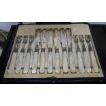 A cased set of six each silver plated fruit knives and forks with silver ferrules and mother-of-