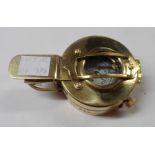 A modern reproduction brass military style compass