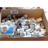 A box containing a large quantity of collectable ceramic and other thimbles including Sutherland