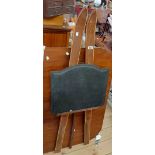 A novelty chalk board and easel of vintage ski form