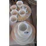 A set of six white glazed Shelley coffee cups and saucers - sold with a small quantity of similar