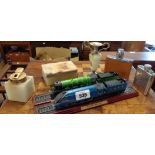 Two modern train models, the Mallard and the Flying Scotsman set on wooden plinths - sold with a