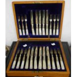 An oak cased set of twelve each silver plated fruit knives and forks with mother-of-pearl handles