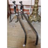 A pair of antique wrought iron fire dogs