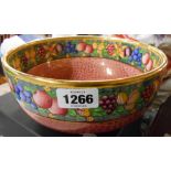 A Mintons Art Deco bowl in the Rotique pattern with colourful fruit decoration and gilt