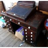 A 1.12m Victorian stained pine twin pedestal clerk's desk with porcelain knob handles to the ten