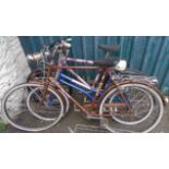 Three assorted bikes including a vintage Raleigh example