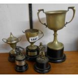 A small collection of silver plated trophy cups including boxing interest, one with silver label -