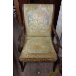 An Edwardian stained walnut framed part show frame scroll armchair with blue and gold tapestry