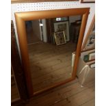 A modern gilt framed oblong wall mirror