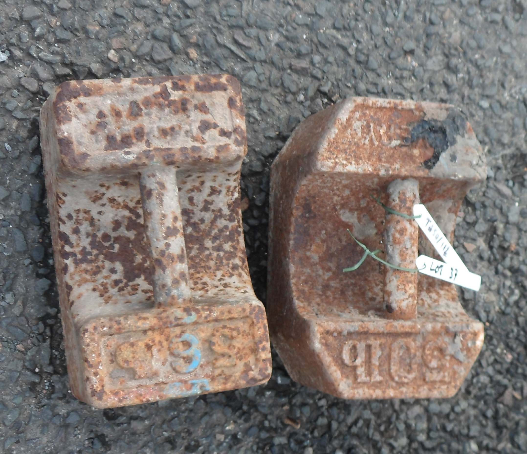 An old cast iron 56lb weight - sold with a similar 50lb weight