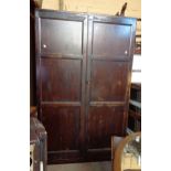 A 1.06 old stained mixed wood wardrobe with hanging space and shelves - cornice and base missing