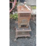 An antique Phoenix paraffin chapel style heater