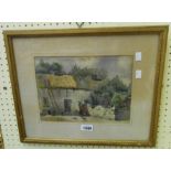 A gilt framed watercolour, depicting farm buildings