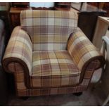 A modern (2019) armchair with studded leather and brown checked upholstery, set on turned feet