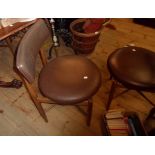 A set of six retro G-Plan dining chairs with dark brown leatherette upholstered backs and seats, set